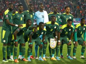 Senegal's starting eleven (top L to R) midfielder Cheikhou Kouyate, forward Ismaila Sarr, forward Famara Diedhiou, goalkeeper Edouard Mendy, defender and captain Kalidou Koulibaly, defender Abdou Diallo, (bottom L to R) defender Saliou Ciss, midfielder Idrissa Gueye, forward Sadio Mane, defender Bouna Sarr, and midfielder Nampalys Mendy pose for a group photo before the start of the 2022 Qatar World Cup African Qualifiers football match between Egypt and Senegal at Cairo International Stadium in the Egyptia
