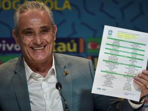 Brazil's coach Tite shows the list of players for the upcoming Qatar 2022 World Cup football tournament, at the Brazilian Football Confederation (CBF) headquarters in Rio de Janeiro, Brazil, on November 7, 2022. (Photo by Carl DE SOUZA / AFP)