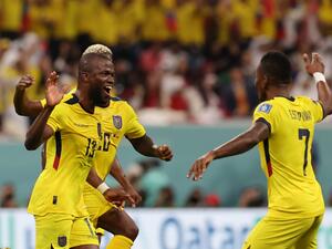 Ecuador's forward #13 Enner Valencia (L) celebrates with Ecuador's defender #07 Pervis Estupinan after he scored his team's second goal during the Qatar 2022 World Cup Group A football match between Qatar and Ecuador at the Al-Bayt Stadium in Al Khor, north of Doha on November 20, 2022. (Photo by KARIM JAAFAR / AFP)