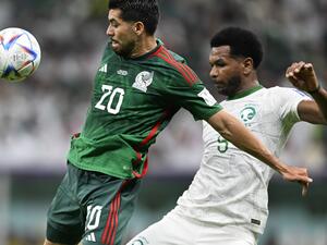 Saudi Arabia's defender #05 Ali Al-Bulaihi (R) fights for the ball with Mexico's forward #20 Henry Martin (L) during the Qatar 2022 World Cup Group C football match between Saudi Arabia and Mexico at the Lusail Stadium in Lusail, north of Doha on November 30, 2022. (Photo by PATRICIA DE MELO MOREIRA / AFP)