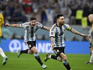 Argentina's forward #10 Lionel Messi (2ndR) celebrates with Argentina's forward #09 Julian Alvarez after he scored his team's first goal during the Qatar 2022 World Cup round of 16 football match between Argentina and Australia at the Ahmad Bin Ali Stadium in Al-Rayyan, west of Doha on December 3, 2022. (Photo by Alfredo ESTRELLA / AFP)