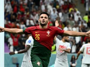 Portugal's forward #26 Goncalo Ramos celebrates scoring his team's fifth goal, his hat-trick, during the Qatar 2022 World Cup round of 16 football match between Portugal and Switzerland at Lusail Stadium in Lusail, north of Doha on December 6, 2022. (Photo by Jewel SAMAD / AFP)