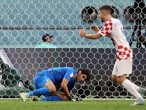 Croatia's forward #09 Andrej Kramaric (R) celebrates as Morocco's goalkeeper #01 Yassine Bounou fails to save their second goal during the Qatar 2022 World Cup third place play-off football match between Croatia and Morocco at Khalifa International Stadium in Doha on December 17, 2022. (Photo by JACK GUEZ / AFP)
