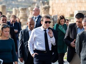French President Emmanuel Macron (C) visits the archaeological site of Jerash, on December 21, 2022. (Photo by Eliot BLONDET / POOL / AFP) French President Emmanuel Macron