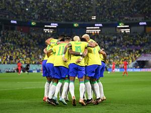 Brazil's forward #10 Neymar (C) celebrates with teammates after he scored his team's second goal from the penalty spot during the Qatar 2022 World Cup round of 16 football match between Brazil and South Korea at Stadium 974 in Doha on December 5, 2022. (Photo by MANAN VATSYAYANA / AFP)