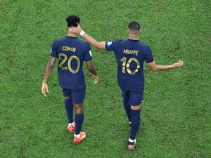 France's forward #10 Kylian Mbappe (R) consoles France's forward #20 Kingsley Coman (L) after Coman missed in the penalty shoot-out during the Qatar 2022 World Cup final football match between Argentina and France at Lusail Stadium in Lusail, north of Doha on December 18, 2022. (Photo by Giuseppe CACACE / AFP)