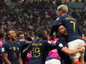 France's forward #09 Olivier Giroud celebrates scoring his team's second goal with teammate forward #07 Antoine Griezmann during the Qatar 2022 World Cup quarter-final football match between England and France at the Al-Bayt Stadium in Al Khor, north of Doha, on December 10, 2022. (Photo by ADRIAN DENNIS / AFP)