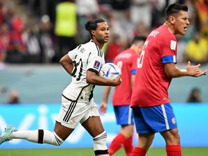 Germany's forward #10 Serge Gnabry (L) celebrates scoring his team's first goal during the Qatar 2022 World Cup Group E football match between Costa Rica and Germany at the Al-Bayt Stadium in Al Khor, north of Doha on December 1, 2022. (Photo by Raul ARBOLEDA / AFP)