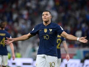 France's forward #10 Kylian Mbappe celebrates scoring his team's third goal during the Qatar 2022 World Cup round of 16 football match between France and Poland at the Al-Thumama Stadium in Doha on December 4, 2022. (Photo by FRANCK FIFE / AFP)