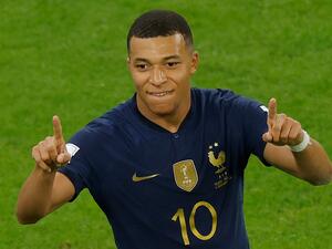 France's forward #10 Kylian Mbappe celebrates scoring his team's second goal during the Qatar 2022 World Cup round of 16 football match between France and Poland at the Al-Thumama Stadium in Doha on December 4, 2022. (Photo by Odd ANDERSEN / AFP)