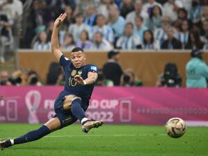 France's forward #10 Kylian Mbappe strikes the ball to score his team's second goal during the Qatar 2022 World Cup football final match between Argentina and France at Lusail Stadium in Lusail, north of Doha on December 18, 2022. (Photo by FRANCK FIFE / AFP)