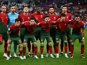 Players of Portugal pose for the team picture ahead of the Qatar 2022 World Cup round of 16 football match between Portugal and Switzerland at Lusail Stadium in Lusail, north of Doha on December 6, 2022. (Photo by Anne-Christine POUJOULAT / AFP)