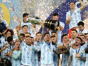 Argentina's Lionel Messi holds the trophy as he celebrates with teammates after beating 1-0 Brazil in the Copa America final. (Shutterstock/ file photo) World Cup