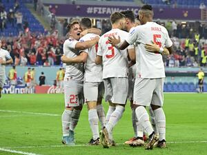 Switzerland's midfielder #08 Remo Freuler (2-L) celebrates with midfielder #23 Xherdan Shaqiri and other teammates after scoring his team's third goal during the Qatar 2022 World Cup Group G football match between Serbia and Switzerland at Stadium 974 in Doha on December 2, 2022. (Photo by JAVIER SORIANO / AFP)