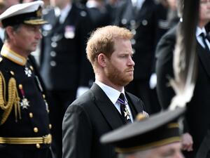 Britain's Prince Harry follows the coffin of Queen Elizabeth II. (Photo by STEPHANE DE SAKUTIN / POOL / AFP) Prince Harry