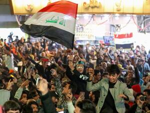 Iraq supporters celebrate their team's win in the Arabian Gulf Cup semi-final football match between Iraq and Qatar in the central holy shrine city of Najaf on January 16, 2023 (Photo by Asaad NIAZI / AFP) Arabian Gulf