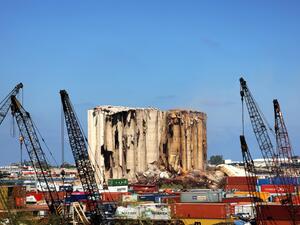 This file photo taken on August 12, 2022 shows a part of the middle grain silos in the port of Beirut which collapsed that week following the damage caused by the August 4, 2020 massive explosion that hit the Lebanese harbour.(Photo by JOSEPH EID / AFP) Beirut blast