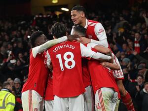 Arsenal's English striker Eddie Nketiah celebrates with teammates after scoring their third goal during the English Premier League football match between Arsenal and Manchester United at the Emirates Stadium in London on January 22, 2023. (Photo by Glyn KIRK / AFP)