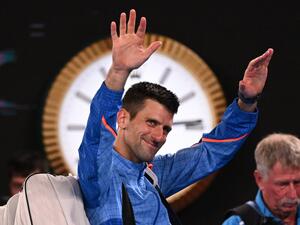 Serbia's Novak Djokovic waves as he leaves after victory against Tommy Paul of the US during their men's singles semi-final match on day twelve of the Australian Open tennis tournament in Melbourne on January 27, 2023. (Photo by WILLIAM WEST / AFP)