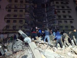 In this video grab from AFP TV taken on February 6, 2023, rescuers search for victims of a 7.8-magnitude earthquake that hit Diyarbakir, in southeastern Turkey, levelling buildings across several cities and causing damages in neighbouring Syria. (Photo by Mahmut BOZARSLAN / AFPTV / AFP) Turkey earthquake