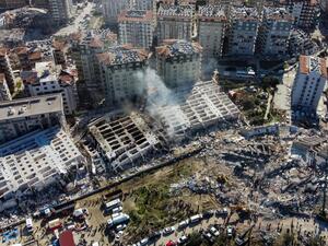 This aerial view shows collapsed buildings in Hatay, southeastern Turkey, on February 8, 2023, two days after a strong earthquake struck the region. (Photo by DHA (Demiroren News Agency) / AFP)  How did earthquake change Turkey's place on map?