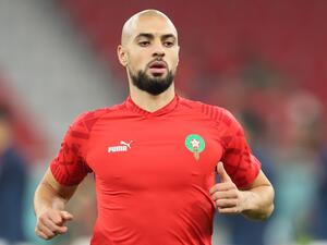 Morocco's midfielder #04 Sofyan Amrabat warms up before the Qatar 2022 World Cup quarter-final football match between Morocco and Portugal at the Al-Thumama Stadium in Doha on December 10, 2022. (Photo by KARIM JAAFAR / AFP)
