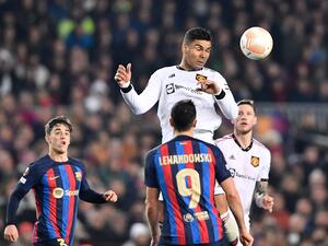 Manchester United's Brazilian midfielder Casemiro heads the ball during the UEFA Europa League round of 32 first-leg football match between FC Barcelona and Manchester United at the Camp Nou stadium in Barcelona, on February 16, 2023. (Photo by Pau BARRENA / AFP)