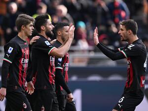 AC Milan's French forward Olivier Giroud (2ndL) celebrates with teammates after scoring during the Italian Serie A football match between AC Milan and Sassuolo, at the San Siro stadium in Milan, on January 29, 2023. (Photo by MIGUEL MEDINA / AFP)