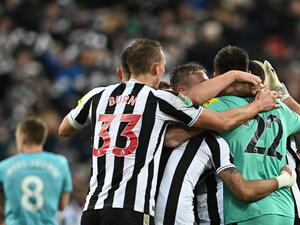 Newcastle United's teammates celebrate at the end of the English League Cup semi final football match between Newcastle United and Southampton at St James's Park stadium in Newcastle, on January 31, 2023. - Newcastle United won 2 - 1 against Southampton. (Photo by Paul ELLIS / AFP)