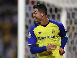 Nassr's Portuguese forward Cristiano Ronaldo celebrates scoring his team's second goal during the Saudi Pro League football match between Al-Wehda and Al-Nassr at the King Abdulaziz Stadium in Mecca on February 9, 2023. (Photo by AFP)