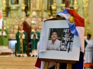 View of a picture of the late Fernando Báez Sosa, the 18-year-old son of Paraguayans who was beaten to death in Argentina in 2020, during a mass in his honour on February 5, 2023 in Asuncion. (Photo by NORBERTO DUARTE / AFP)