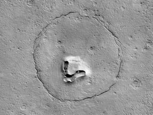 a satellite image of Mars showing a teddy bear face printed on Martian rocks. (NASA/JPL-CALTECH/UARIZONA) teddy bear