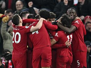  Liverpool's Brazilian striker Roberto Firmino celebrates with teammates after scoring their seventh goal during the English Premier League football match between Liverpool and Manchester United at Anfield in Liverpool, north west England on March 5, 2023. Liverpool won the game 7-0. (Photo by Paul ELLIS / AFP)