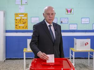 A handout picture provided by the press service of Tunisian presidency shows President Kais Saied casting his ballot at a polling station in the Ennasr district near Tunis on December 17, 2022, during the parliamentary election. (Photo by Tunisian Presidency / AFP) Kais Saied