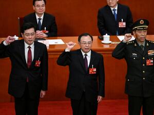  Li Shangfu swear an oath after they were elected during the fifth plenary session of the National People's Congress (NPC) at the Great Hall of the People in Beijing 