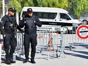 Members of the Tunisian police block the entrance to the Parliament as the new assembly holds its first session in Tunis, on March 13, 2023. (Photo by FETHI BELAID / AFP) new parliament