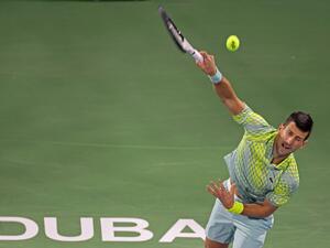 Serbia's Novak Djokovic hits a return against Netherlands' Tallon Griekspoor during their Dubai Duty Free Tennis Championship match in Dubai on March 1, 2023. (Photo by Karim SAHIB / AFP)