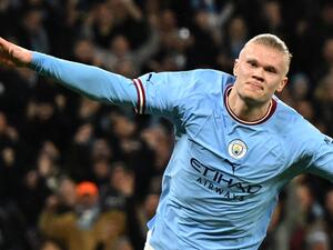 Manchester City's Norwegian striker Erling Haaland celebrates after scoring the opening goal in the English FA Cup quarter-final football match between Manchester City and Burnley at the Etihad Stadium in Manchester, north-west England, on March 18, 2023. (Photo by Oli SCARFF / AFP) 