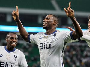 Hilal's Nigerian forward Odion Ighalo (C) celebrates with teammates after scoring his fourth goal during the AFC Champions League semi-final football match between al-Duhail and al-Hilal at al-Thumama Stadium in Doha on February 26, 2023. (Photo by KARIM JAAFAR / AFP) 