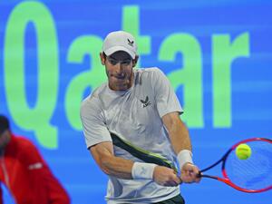 Britain's Andy Murray hits a return against Russia's Daniil Medvedev (unseen) during their Qatar Open final tennis match in Doha, on February 25, 2023. (Photo by KARIM JAAFAR / AFP)