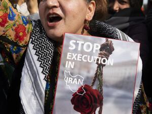 Activists hold a demonstration at the Lincoln Memorial to denounce the Iranian government and express support with anti-government protesters in Iran, in Washington, DC, on February 11, 2023. (Photo by ROBERTO SCHMIDT / AFP) executions
