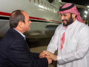 In this handout picture obtained from the Saudi Royal Palace, Crown Prince Mohammed bin Salman (R) welcomes Egypt's President Abdel Fattah el-Sisi in Jeddah late on April 2, 2023. (Photo by Saudi Royal Palace / AFP) Abdel Fattah el-Sisi