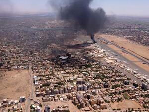 TOPSHOT - This image grab taken from AFPTV video footage on April 20, 2023, shows an aerial view of black smoke rising above the Khartoum International Airport amid ongoing battles between the forces of two rival generals. Hundreds of people have been killed since the fighting erupted on April 15 between forces loyal to Sudan's army chief Abdel Fattah al-Burhan and his deputy, Mohamed Hamdan Daglo, who commands the paramilitary Rapid Support Forces (RSF). (Photo by AFP) US evacuates 70 embassy staff from Sudan