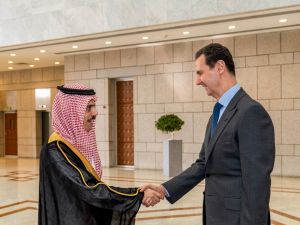 This handout picture released by the Syrian Presidency Facebook page shows Syria's President Bashar al-Assad (R) receiving Saudi Arabia's Foreign Minister Faisal bin Farhan in Damascus on April 18, 2023. (Photo by Syrian Presidency Facebook page / AFP) Arab League