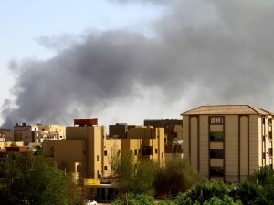 Smoke billows in the distance in Khartoum amid ongoing fighting between the forces of two rival generals, on May 15, 2023. (Photo by AFP) Sudan