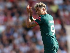 Liverpool's Brazilian striker Roberto Firmino applauds fans as he leaves on his final Liverpool appearance during the English Premier League football match between Southampton and Liverpool at St Mary's Stadium in Southampton, southern England on May 28, 2023. (Photo by Adrian DENNIS / AFP) 
