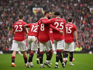 Manchester United's Portuguese midfielder Bruno Fernandes celebrates with Manchester United's English striker Jadon Sancho after scoring his team first goal during the English Premier League football match between Manchester United and Aston Villa at Old Trafford in Manchester, north west England, on April 30, 2023. (Photo by Oli SCARFF / AFP) 