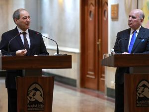 Iraqi Foreign Minister Fuad Hussein (R) and his Syrian counterpart Faisal Mekdad hold a press conference in Baghdad on June 4, 2023. (Photo by AHMAD AL-RUBAYE / AFP) Faisal Mekdad and Fuad Hussein