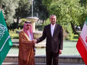 Iran's Foreign Minister Hossein Amir-Abdollahian (R) shakes hands with his Saudi counterpart Faisal bin Farhan in Tehran on June 17, 2023. (Photo by Atta KENARE / AFP) Saudi Foreign Minister Faisal bin Farhan