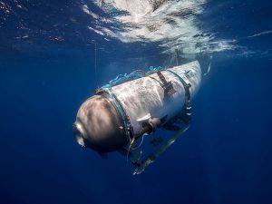 This undated image courtesy of OceanGate Expeditions, shows their Titan submersible beginning a descent. Rescue teams expanded their search underwater on June 20, 2023.  Titanic submarine